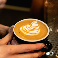 A flat white with latte art at What's Cooking, Thame